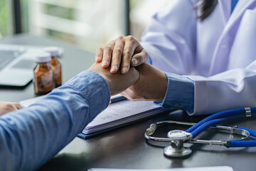 Health care concepts of a professional psychologist doctor. Counseling in psychotherapy or consulting on diagnosis
A female doctor sits at a table and talks to the patient.