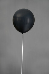 black color balloon isolated in grey background