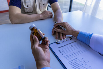 Health care concepts of a professional psychologist doctor. Counseling in psychotherapy or consulting on diagnosis
A female doctor sits at a table and talks to the patient.