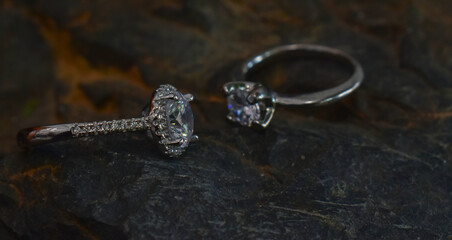 A diamond ring is a glittering wedding ring placed on the ground.