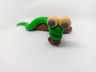 Snake in clay by the kids playing by self. It's green cute snake and fun.