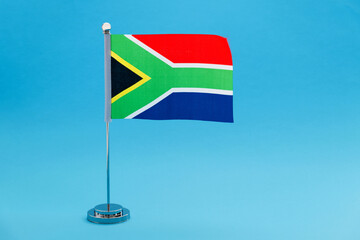 South Africa table flag waving on blue background