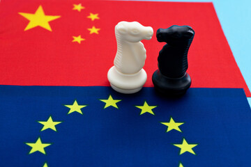 Two knights standing on Chinese flag and EU flag