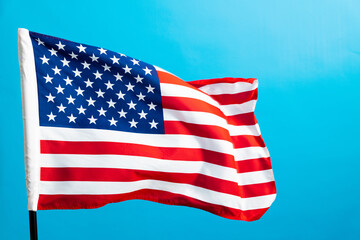 Obraz premium American flag waving on blue background