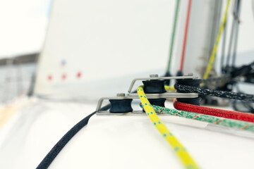 Yacht rigging, ropes and a system of blocks. Front view.