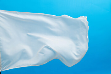 White flag waving on blue background