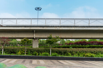 Pedestrian bridge against blue sky