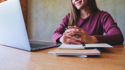 Closeup image of a businesswoman working on laptop computer
