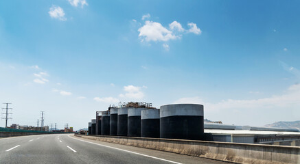 Fototapeta premium Big oil tanks beside the road