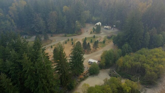 Top down view of the campsite in the forest and road behind the trees
