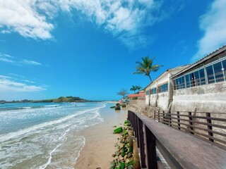 Pier on the beach with a beautiful sky
