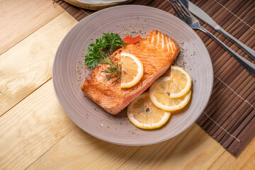 Salmon Steak, served with bread, ready to eat, Grilled Salmon with lemon.