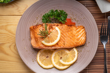 Salmon Steak, served with bread, ready to eat, Grilled Salmon with lemon.