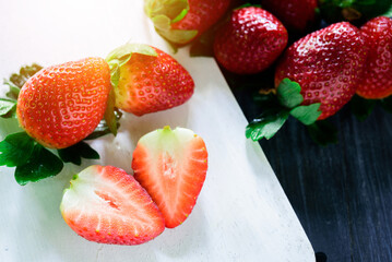 Fresh strawberry on wood background, top view, close up