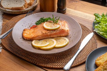 Salmon Steak, served with bread, ready to eat, Grilled Salmon with lemon.