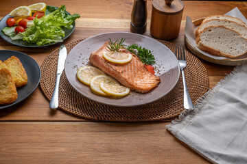 Salmon Steak, served with bread, ready to eat, Grilled Salmon with lemon.