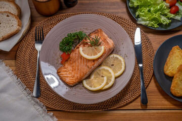 Salmon Steak, served with bread, ready to eat, Grilled Salmon with lemon.
