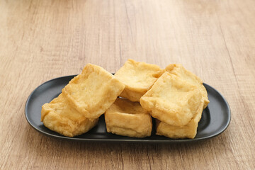 Tahu Goreng or Fried Tofu, Indonesia traditional food, made from fermented soybean extract.
