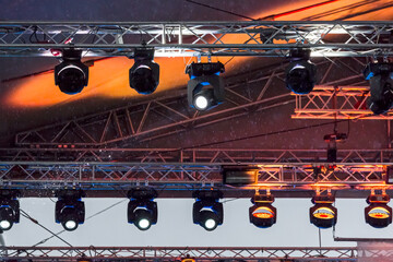 professional stage spotlight equipment on outdoor concert stage. concert light show.