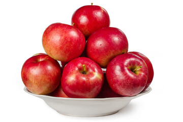 Lots of red apples in a plate on a white background.