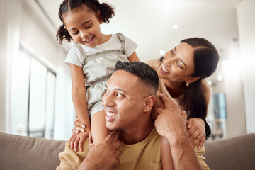 Family, children and playful with a girl, mother and father bonding on a sofa in their home together. Kids, love and living room with a man, woman and daughter playing together in their house