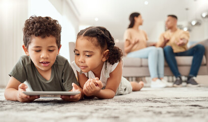 Kids on floor with tablet in living room, watching fun and educational videos or playing game online with parents on sofa. Technology, internet and children play on carpet with mobile app together. - Powered by Adobe