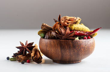 Different types of spices in wooden bowl