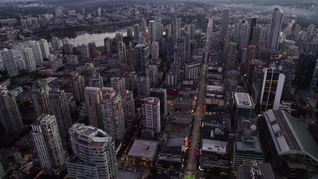 Aerial view of streets and buildings in central Vancouver, evening in BC, Canada