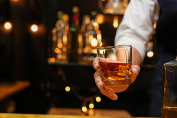 Bartender pouring Whiskey, on  bar,