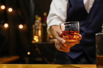 Bartender pouring Whiskey, on  bar,