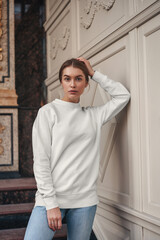Women white sweatshirt mockup with model outdoor background