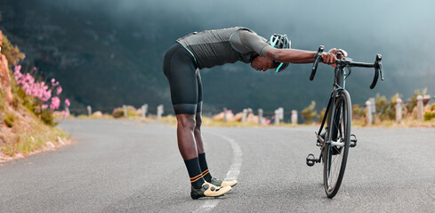 Sports man, stretch and cycling break along mountain route by cyclist resting during fitness, exercise and morning cardio. Stretching, bicycle and black man stop for rest during physical performance - obrazy, fototapety, plakaty