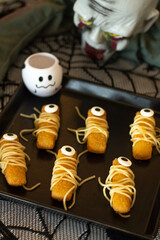 Halloween party.  Eyes  fish finger with spagetti. Halloween decorations Halloween food concept