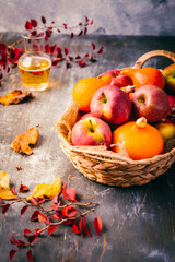 Obraz na płótnie Canvas Autumn composition with pumpkins, autumn leaves, red apples and apple cider