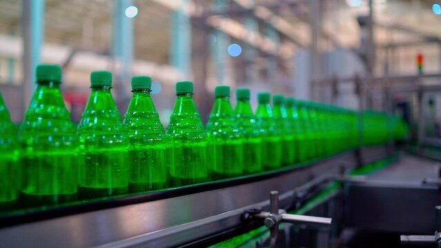 Row of bottle in conveyer at water factory