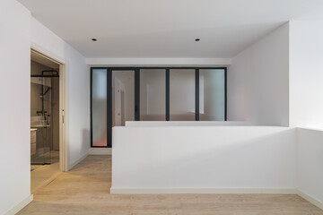Interior of empty flat with doorway to bathroom. White and clean room in refurbished apartment