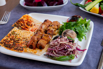 Traditional lamb kebab with salad in morocco
