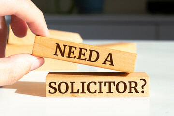 Wooden blocks with words 'Need a Solicitor?'.