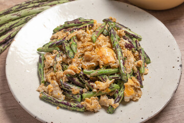 Stir fried Yardlong bean with eggs on wooden background