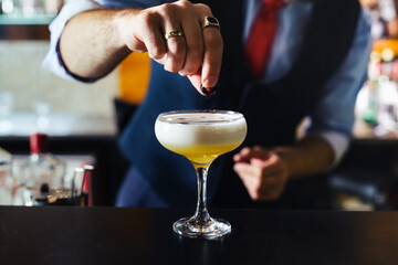 Champagne coupe glass of refreshing orange cocktail