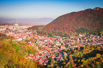Brasov, Romania - Autumn landscape with historical city in Transylvania, Carpathian Mountains. - obrazy, fototapety, plakaty