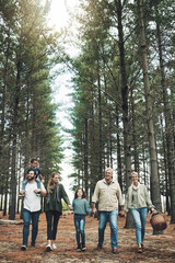 Forest, holding hands and big family walking in nature for outdoor hiking, adventure and wellness...