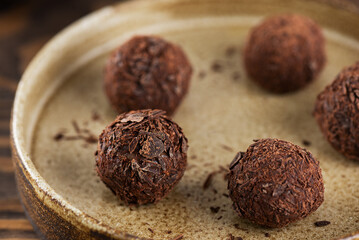 Traditional brazilian brigadeiro chocolates in a plate, homemade.