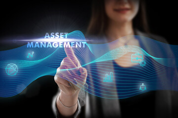 Business, Technology, Internet and network concept. Young businessman working on a virtual screen of the future and sees the inscription: Asset management