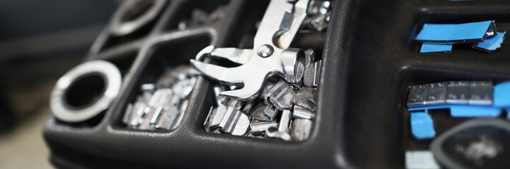 Workers tool kit full of instruments, metal nozzles, parts and equipment