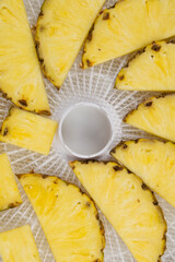 close-up, in a round grate, sliced fresh pineapple for further drying