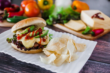 mexican burger with chips and avocado on table food with ingredients in Mexico	