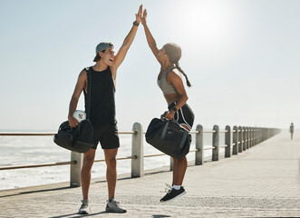Motivation, high five and support with couple and fitness training for health, workout and goals in outdoor. Success, winner and partnership with man and woman jump for exercise, wellness and sports - Powered by Adobe