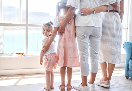 Women, Children And Generations, Rear View At Window, Back Legs And Toddler Girl Looking With Smile. Love, Support And Happy Family Together In Holiday Home In Sydney, Australia On First Vacation Day