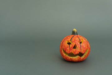 Halloween pumpkin on green background